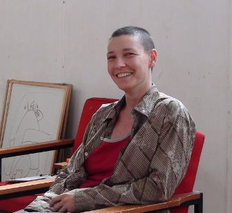 picture of Theo Ktichener seated about to run a workshop with very nice smile