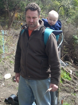 Adrian Whitehead with Baby Lucian in a baby backpack